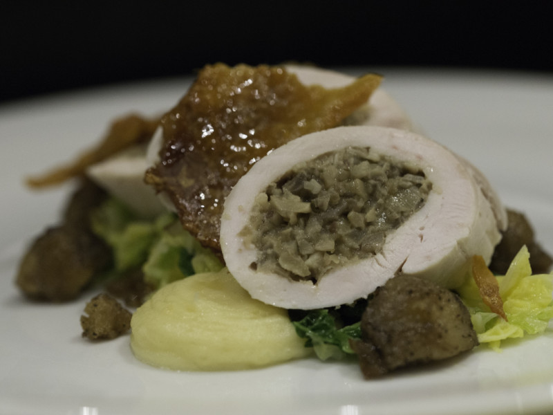 Main course: stuffed chicken breast on greens with garlic mash